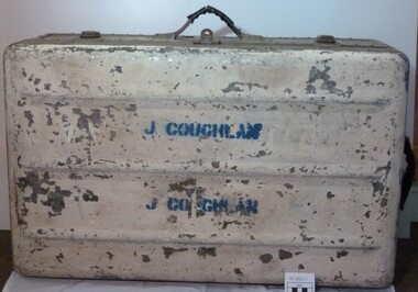 Trunk, all metal rectangular shape with the name Coughlan on the top