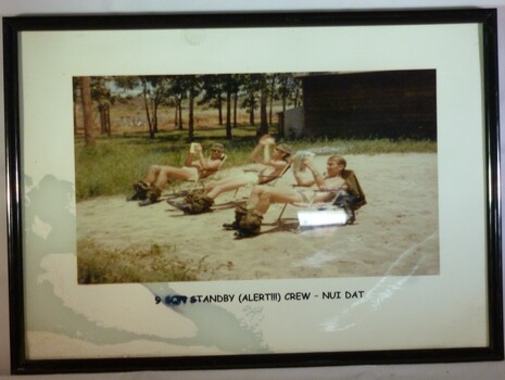 A Framed Coloured Photograph of 9 Sqn Standby (alert!!!) Crew - Nui Dat