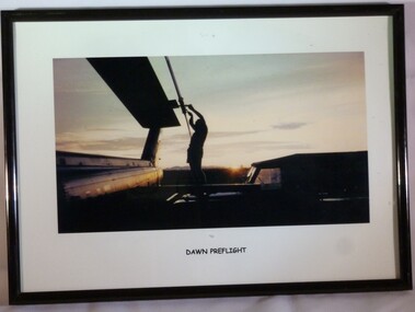 A Framed Colour Photograph of a Soldier Standing on a Bonnet of a Land rover Checking a Propeller