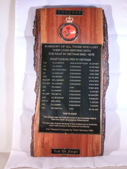 Red ironbark piece of timber with a metal inlay listing names of soldiers who lost their lives in Vietnam.  
