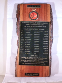 Red ironbark piece of timber with a metal inlay listing names of soldiers who lost their lives in Vietnam.  