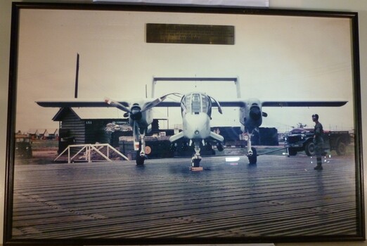 A Framed coloured photograph of a plane