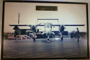 A Framed coloured photograph of a plane