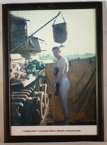 A Framed Coloured Photograph of a Soldier Taking a Shower Beside a Centurion Tank