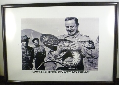 A Framed Black and White Photograph of Commanding Officer RTFV Meets New Friends