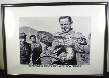 A Framed Black and White Photograph of Commanding Officer RTFV Meets New Friends