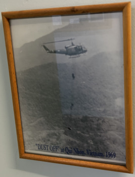 In a Timber Frame a Black and White Photograph Titled Dust Off at Qui Nhon, Vietnam. 1969