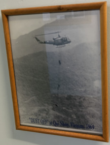 In a Timber Frame a Black and White Photograph Titled Dust Off at Qui Nhon, Vietnam. 1969