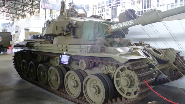 Forward facing A41 Centurion battle tank with mannequins in uniform of Australian tankies in Vietnam uniform visible out of hatches.