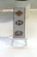 A collection of three badges.