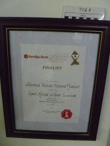Brown, stained wooden frame with gold trim. Finalist, 2011 "Good Access is Good Business" category.
