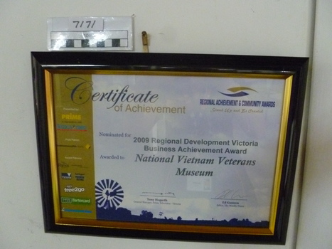 Black plastic frame with gold trim from Regional Achievement & Community Award