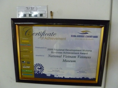 Black plastic frame with gold trim from Regional Achievement & Community Award