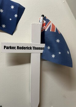 White painted wooden cross with 'Parker, Roderick Thomas Ross 218346