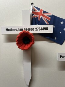 Wooden cross painted White with "Mathers, Ian George 2794496"