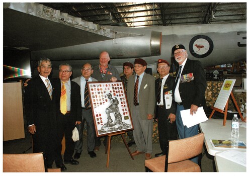 A coloured photo of the VIP's at the ceremony.