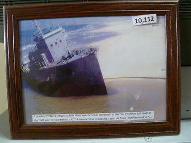 Photograph, A beached VN Navy converted USN mine sweeper near the mouth of the Qua Viet River etc