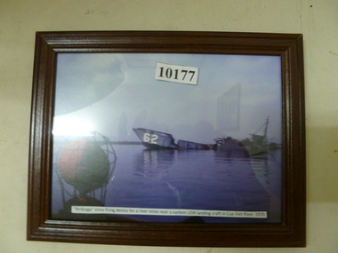 Photograph, Birdcage mining and firing device for a river mine near sunken USN landing craftCua Viet river 1970