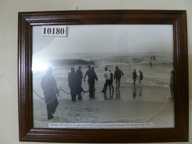Photograph, Salvage attempt of upturned USN Coastal ammunition barge YFU-63 near Hue 1971