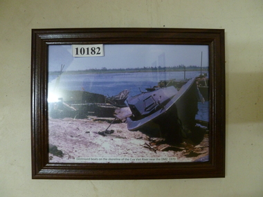 Photograph, Destroyed boats on the shorline of Cua Viet River near the DMZ 1970