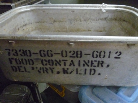 Steel food container with ten small air vents at top of sides