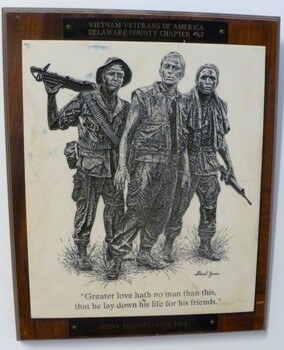 Black etched picture of three US servicemen in field