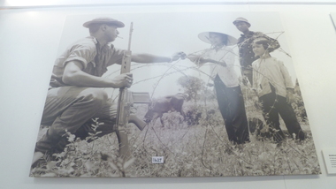 Photograph, Note Book Through Barbed Wire