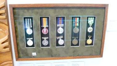 A wooden frame of 10 medals awarded by the Vietnam Government to Australian and New Zealand soliders. 