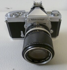 A silver and black Camera Nikkormat