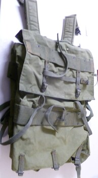 Army khaki canvas backpack and webbing outside camouflage plastic lined