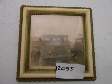 Photograph, Photograph of a militry truck. A second truck is partially seen in the background