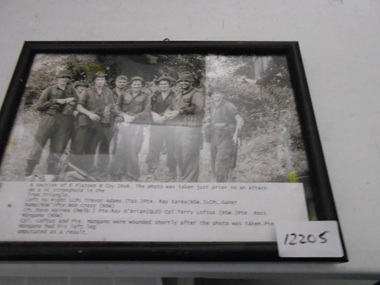 A black and white photo of 8 soldiers from 6 Platoon B Coy 1RAR.