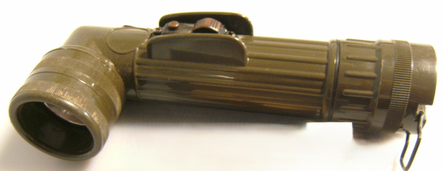 Dark green coloured ribbed tube/handle with globe in right-angled section at top of torch