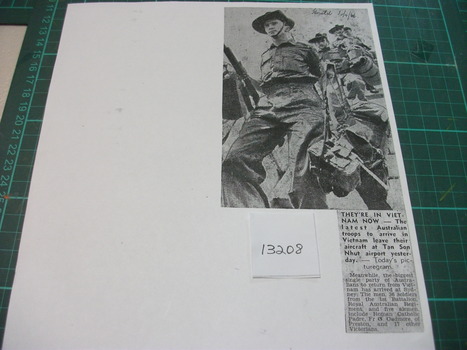 Copy of a newspaper cutting. Picture of Soldiers with full military equipment disembarking their aircraft to start their Tour in Vietnam. 