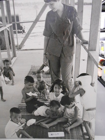 Photograph, Nurse and local children