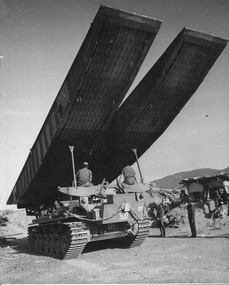 A photograph of a Centurian tank bridge layer stops outside a Vietnamese regional outpost in Long Thanh during Operation Matilda