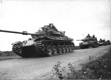 A black and white photograph of a column of Centurian Tanks of 1st Armoured Regt comes to a halt 20/01/1969 during Operation Matilda