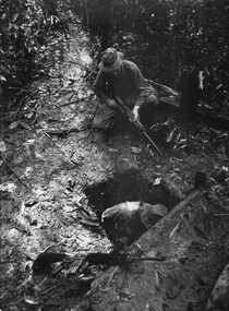 A photograph of Engineers checking out enemy bunkers and tunnels prior to setting explosives and cs crystals to destroy and impregnate the system of tunnels