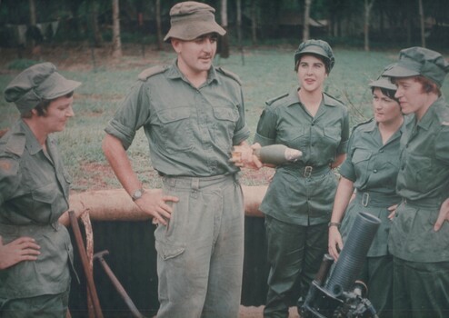 A photo taken during a visit to the 1st Australian Task Force Base, nurses are shown the workings of 7 RAR Mortar Platoon. 