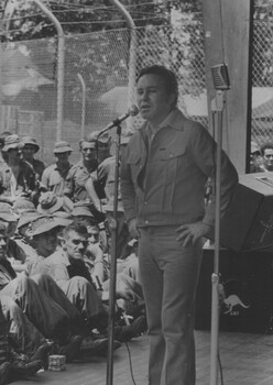 A photograph of Johnny O'Keefe sings before appreciative diggers. O'Keefe with Caroline Page and The Playboys on August 1969 at Nui Dat 