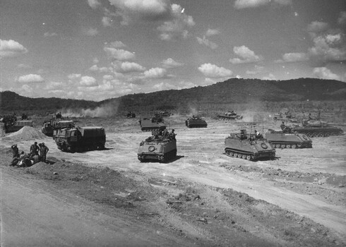 A photograph of APCs and Centurian Tanks from 1st Armoured Regt Harbouring Up in their night location during Operation Matilda. 