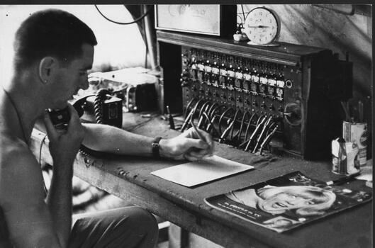 A photograph of Pte Jack Higgins, mannibg the A Coy 7 RAR telephone exchange at 1 ATF Base Nui Dat