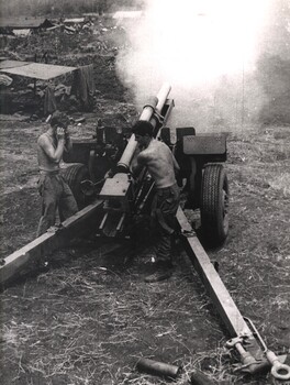 A black and white photograph of Gunners firing on NVA Sappers at Long Bien 