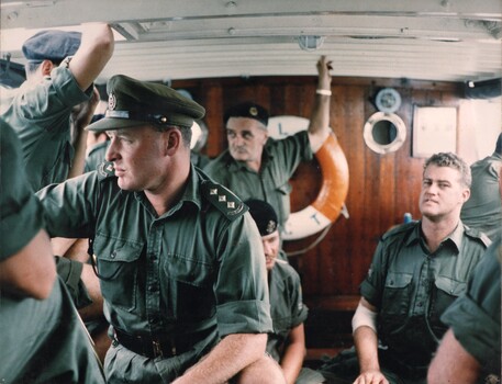 A photograph of soldiers on a Landing Craft along the banks of the Mekong River whilst ferrying supplies to the ARVN at Long Binh. 