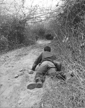 A photograph of TAOR patrol, Long Binh Operation Federal, 7 Platoon, C Company 4 RAR/NZ  the forward scout engages NVA/VietCong sappers. 