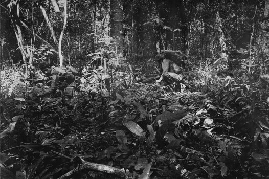 A photograph of Platoon strength, N.W. of 1ATF 'Operation Atherton'  1 Platoon, A Comp 8 RAR diggers under heavy fire.