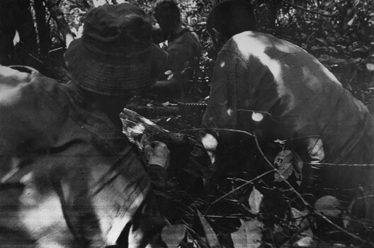 A photograph of Platoon strength N.W. 1ATF 'Operation Atherton' 10 December 1969. 1 Platoon, A Company, 8 RAR under heavy machin gun fire. 