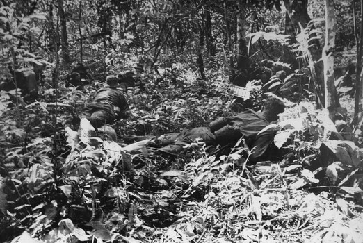 A photograph of Platoon strength N.W. of 1ATF 'Operation Atherton', 1 Platoon, A Company, 8 RAR, under heavy machin gun. 