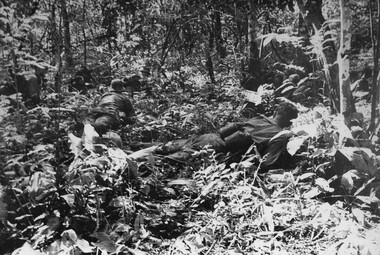 A photograph of Platoon strength N.W. of 1ATF 'Operation Atherton', 1 Platoon, A Company, 8 RAR, under heavy machin gun. 