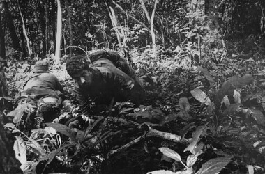 A photograph of Platoon strength N.W.1ATF 'Operation Atherton' 10 December 1969. 1 Platoon, A Company,  8 RAR under heavy machin gun fire. 